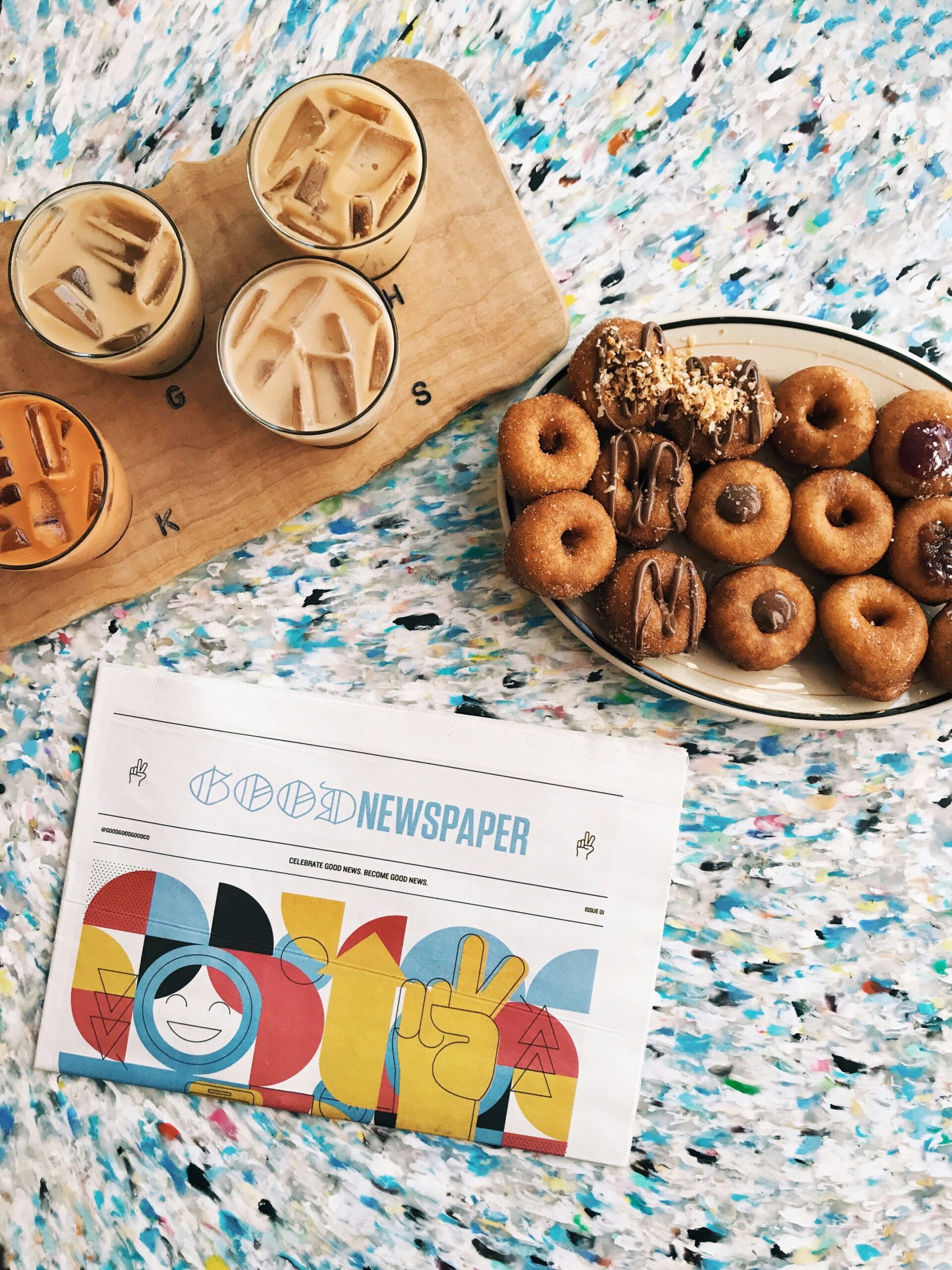 Printed magazine and refreshments on a table